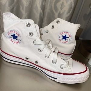 NWOT White high top converse. Never been worn.